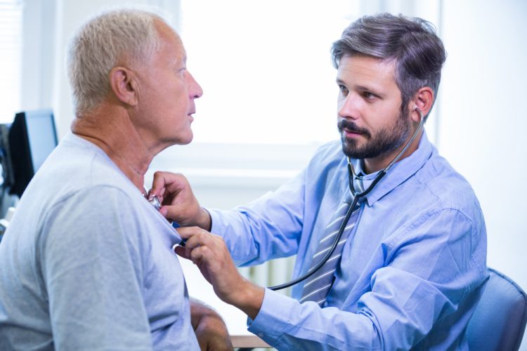 male doctor examining patient